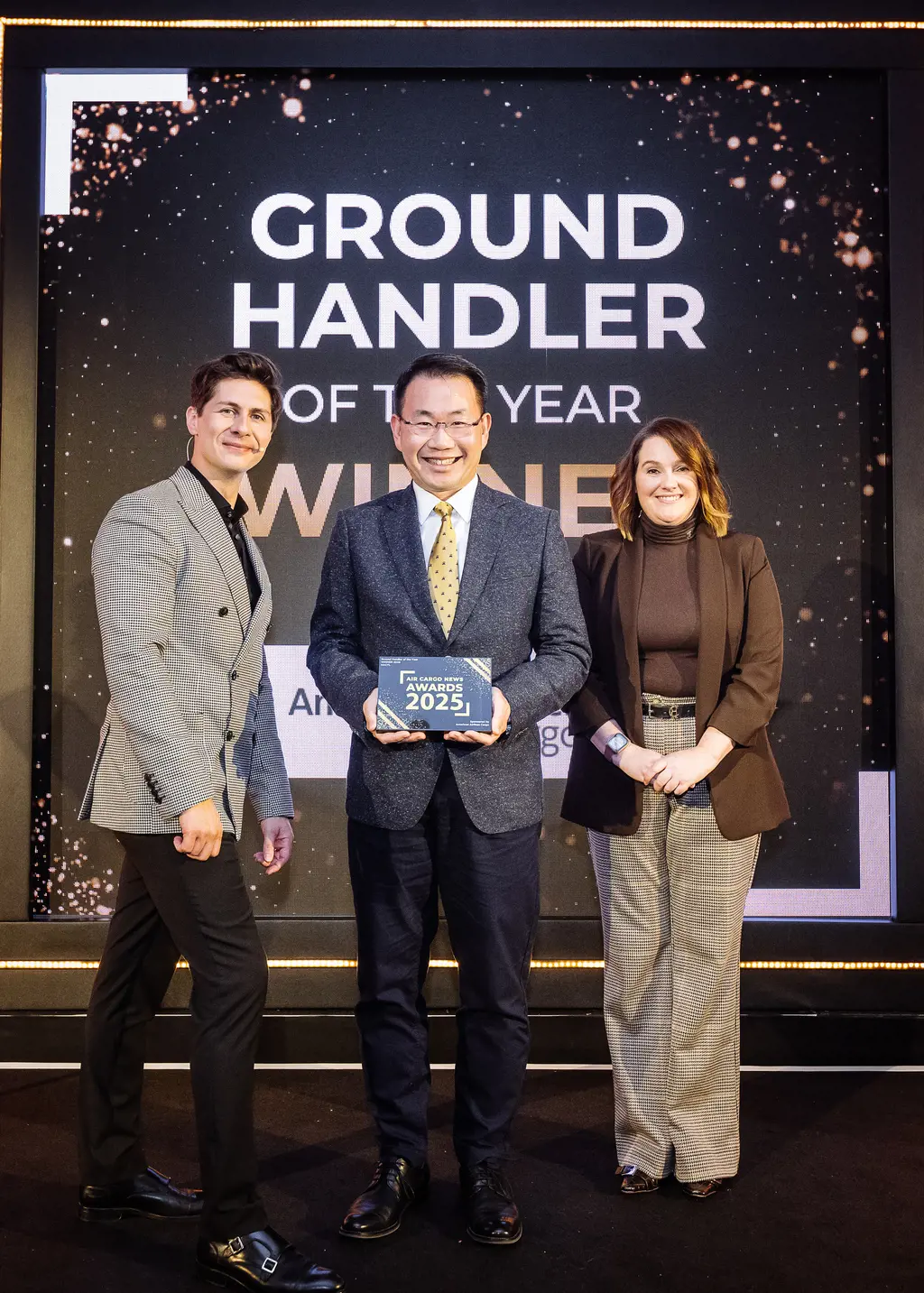 Hactl Chief Executive Wilson Kwong (Middle) Received The “Ground Handler Of The Year” Award At The 2025 Air Cargo News Awards Ceremony