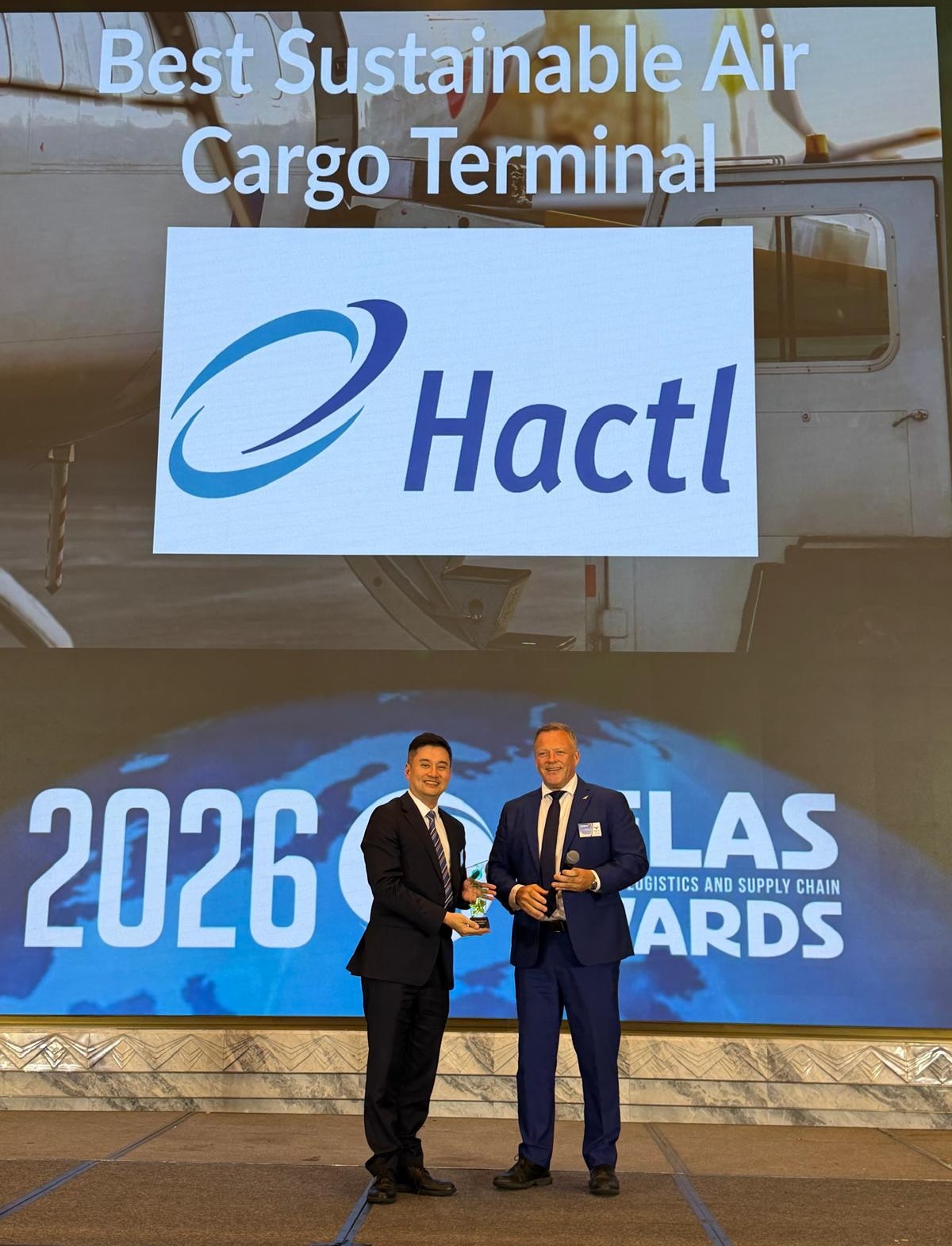 Hactl Chief Executive Frosti Lau (Left) Receives The “Best Sustainable Air Cargo Terminal” Award At This Year’S Asian Freight, Logistics And Supply Chain (AFLAS) Awards.